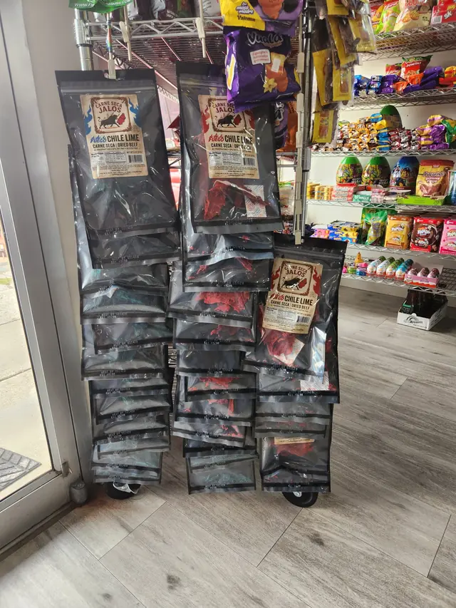Bags of Carne Seca Jalos hanging on a rack inside a Bay Area store